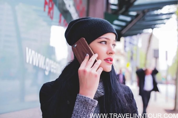 talking on phone - Solo Travel Tips 